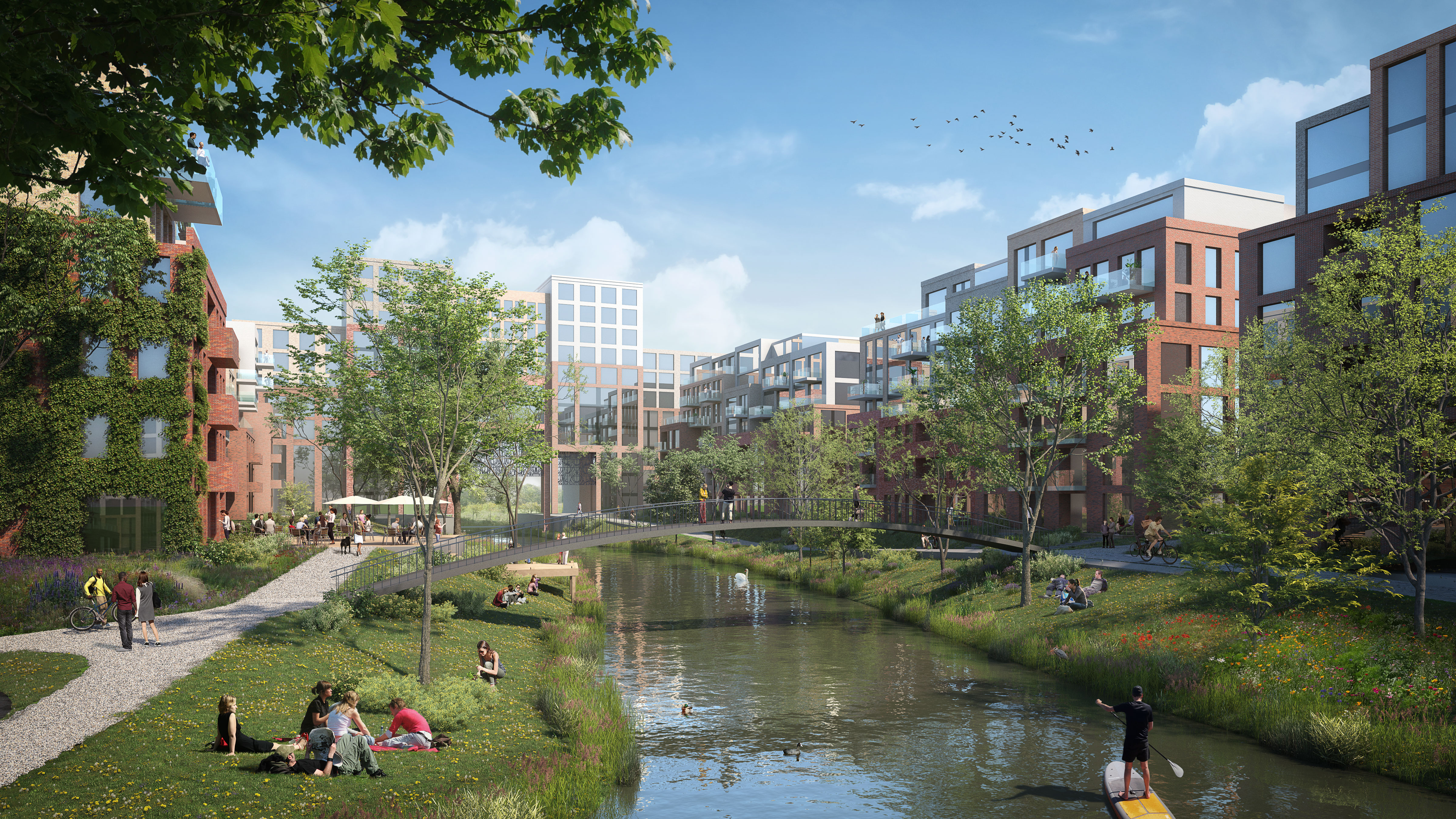 Groene omgeving van het Archimedeskwartier waar mensen recreëren langs het water